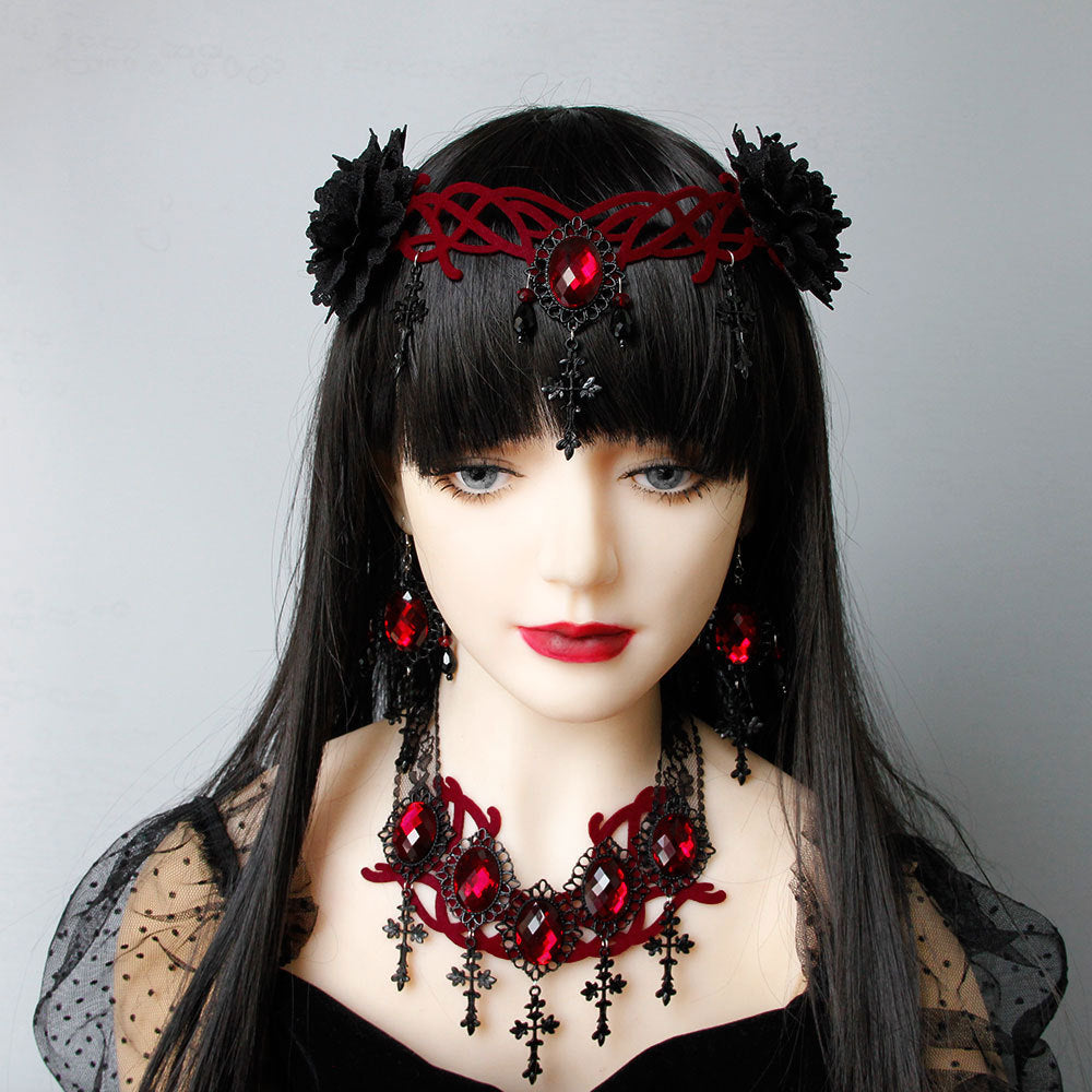 A mannequin displaying a Gothic Style Vampire Death Role Playing Cross Headdress by Maramalive™ in black attire with red jewelry.