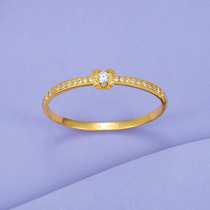 A Maramalive™ Brass Gold-plated Bracelet with diamonds on a purple background.