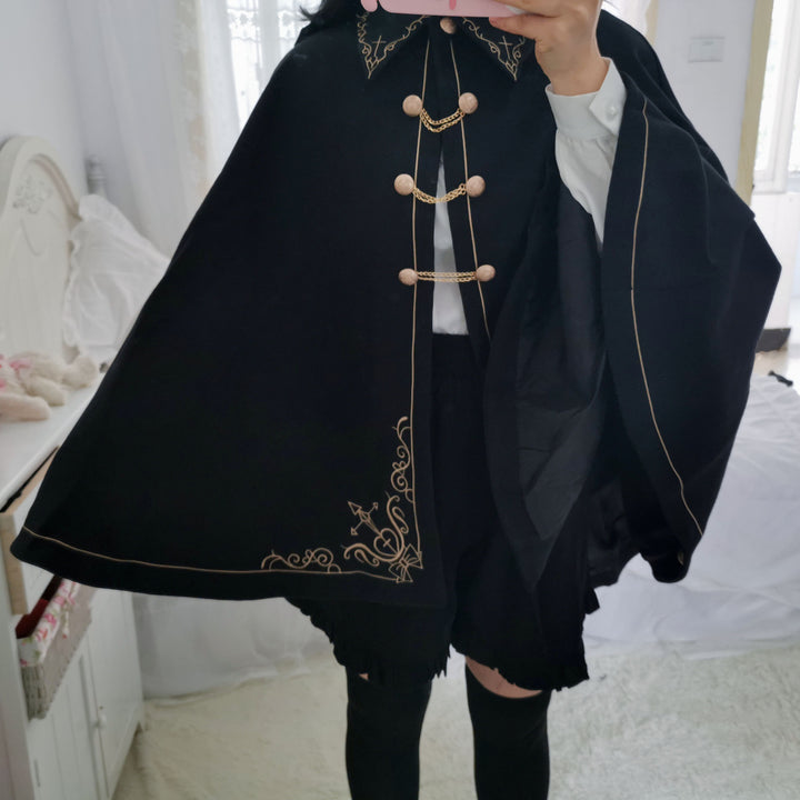 A girl in a Maramalive™ Japanese Style Soft And Hard Girl Cool Cos Role Lapel Dark Night Gothic Handsome Embroidered Swallowtail Woolen Cape Coat Coat taking a selfie.