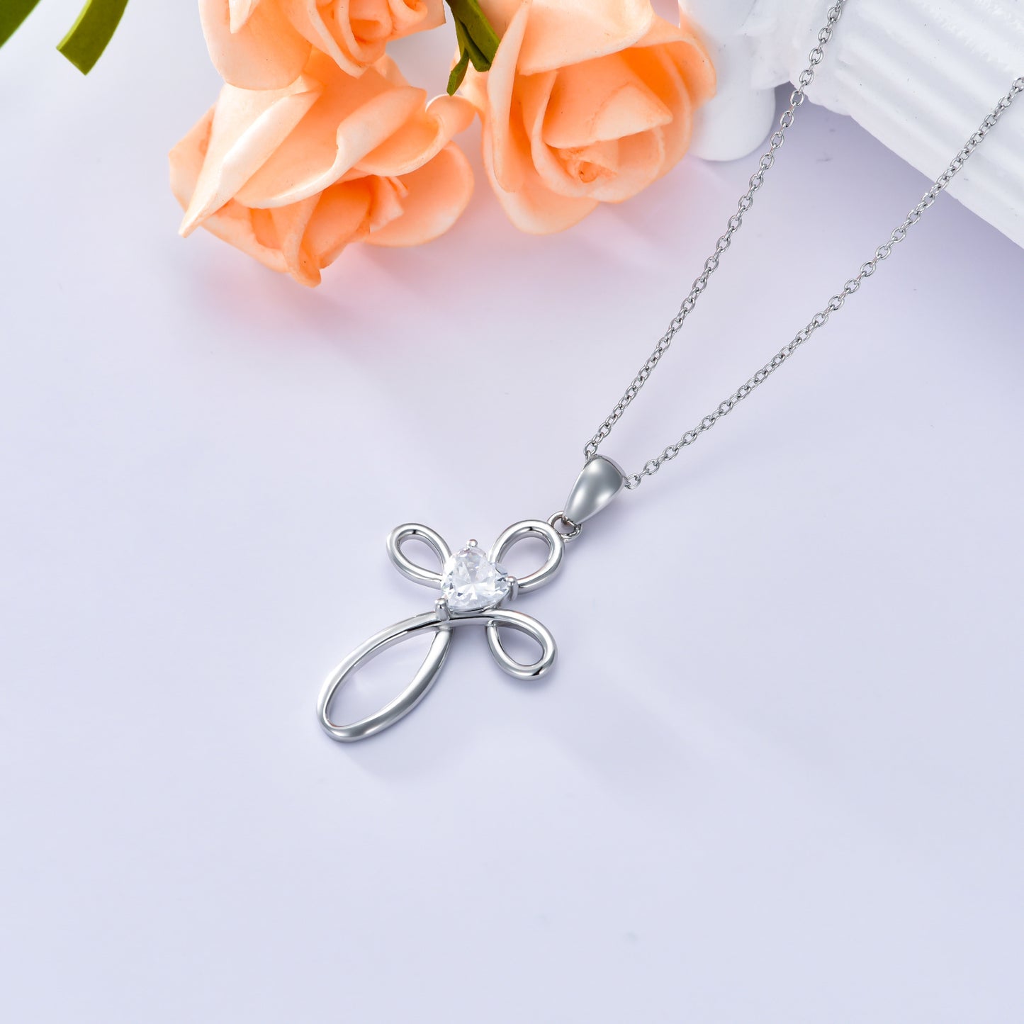 A Maramalive™ Cubic Zirconia Cross Birthstone Pendant Necklace in Sterling Silver for Women Men.