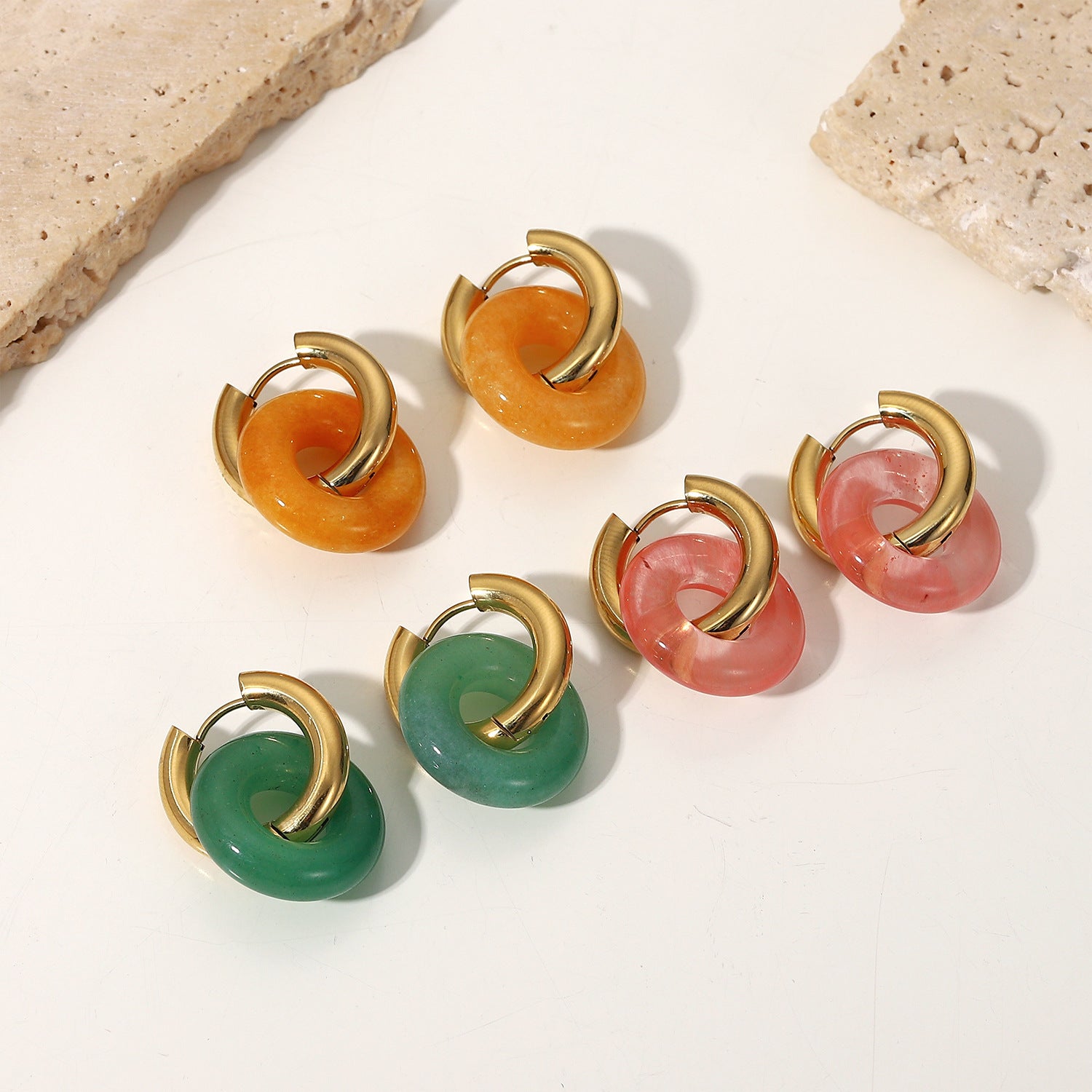A set of Fashion Retro Natural Stone Ring Earrings For Women by Maramalive™ on a satin.
