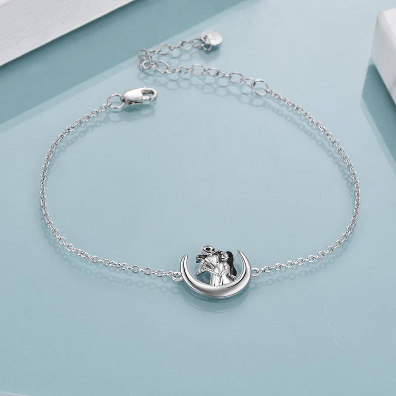 A Moon and Back Jewelry silver bracelet with a crescent on it. Brand Name: Maramalive™.
