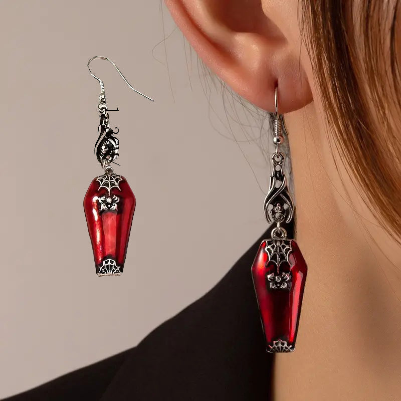 A woman wearing a pair of Maramalive™ Halloween Earrings Ins Style Red Bat Spider Retro Earrings Jewelry.