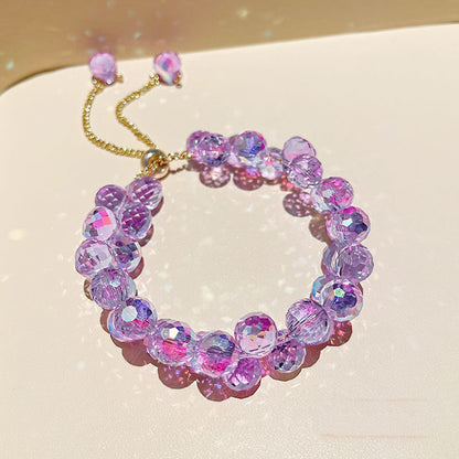 A close up of a person wearing a Maramalive™ White Purple Crystal Adjustable Bracelet Crystal Clear.