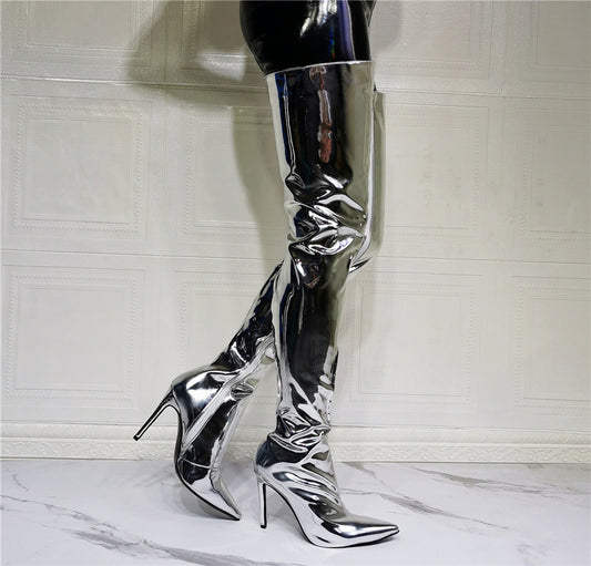 A woman donning fashionable silver Maramalive™ thigh-high boots made of artificial PU.