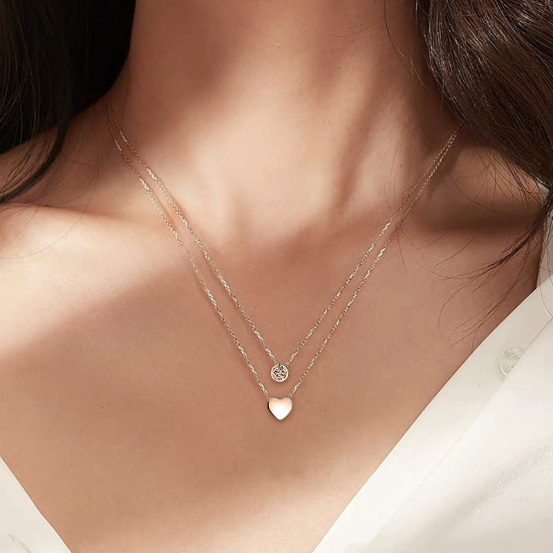 A woman wearing the Maramalive™ If You LOVE ME GET ME Women's Loving Heart Zircon Multi-layer Twin Necklace NOW.