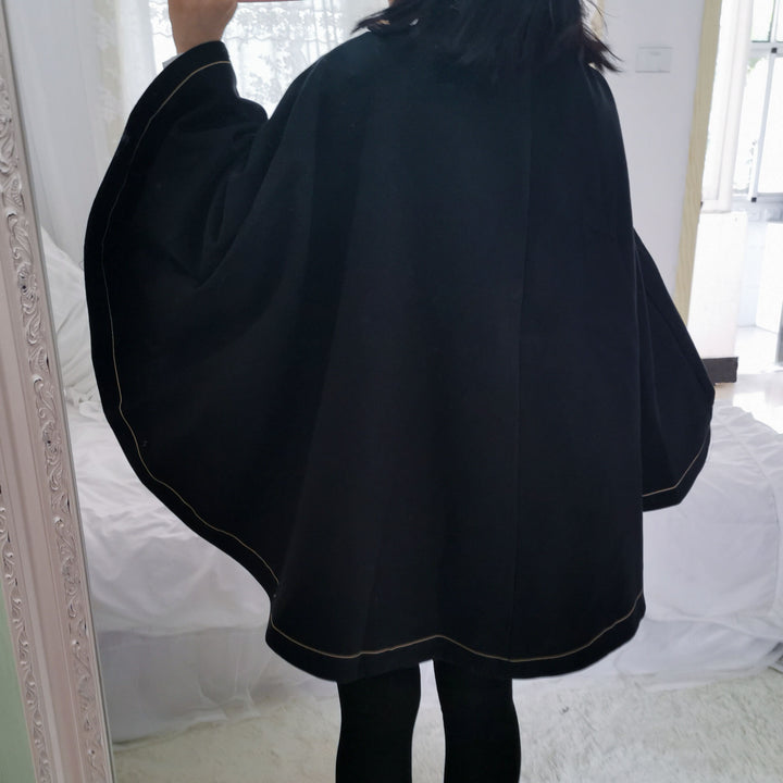 A girl in a Maramalive™ Japanese Style Soft And Hard Girl Cool Cos Role Lapel Dark Night Gothic Handsome Embroidered Swallowtail Woolen Cape Coat Coat taking a selfie.