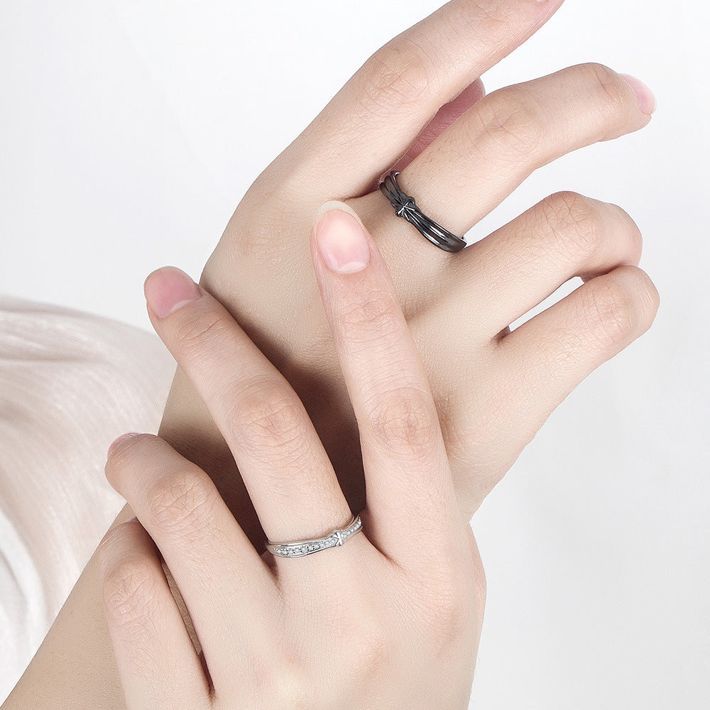 A woman's hand with two Maramalive™ Black Minimalist Rings on it.