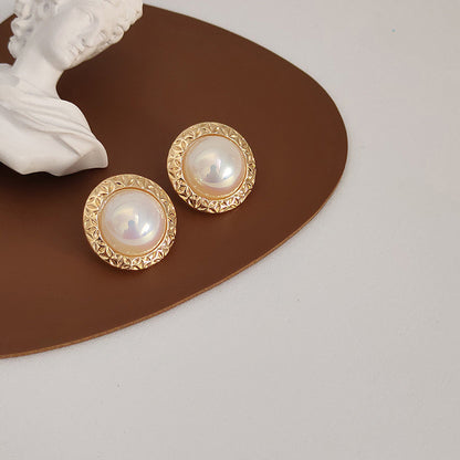 A pair of French Retro Pearl Earrings by Maramalive™, gold plated stud earrings.