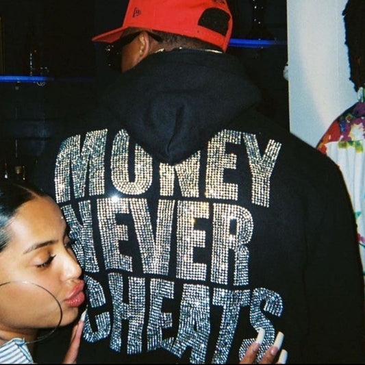 A person in a black Maramalive™ Letter New Long-sleeve Zipper Hoodie Fashion Casual Punk Coat Sweatshirt with "Money Never Cheats" written in rhinestones and a woman with tied-back hair, sporting a chic Women's cardigan, posing next to them.