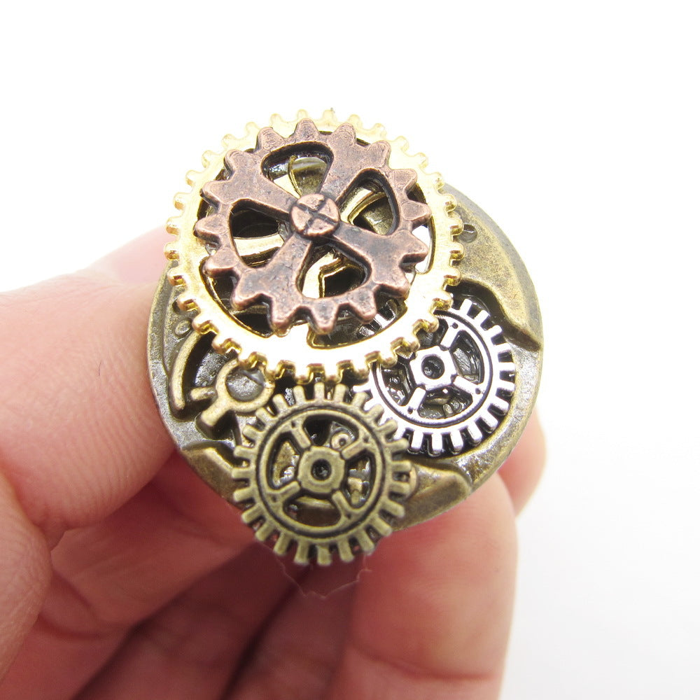 A person is holding a small Maramalive™ European And American Jewelry Steampunk Series Ring with gears on it.
