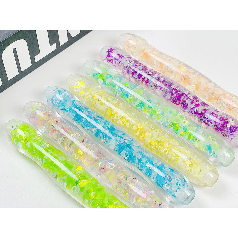 A bunch of Luminous Pen Maramalive™ Dot Drill Pens with glitter on them.