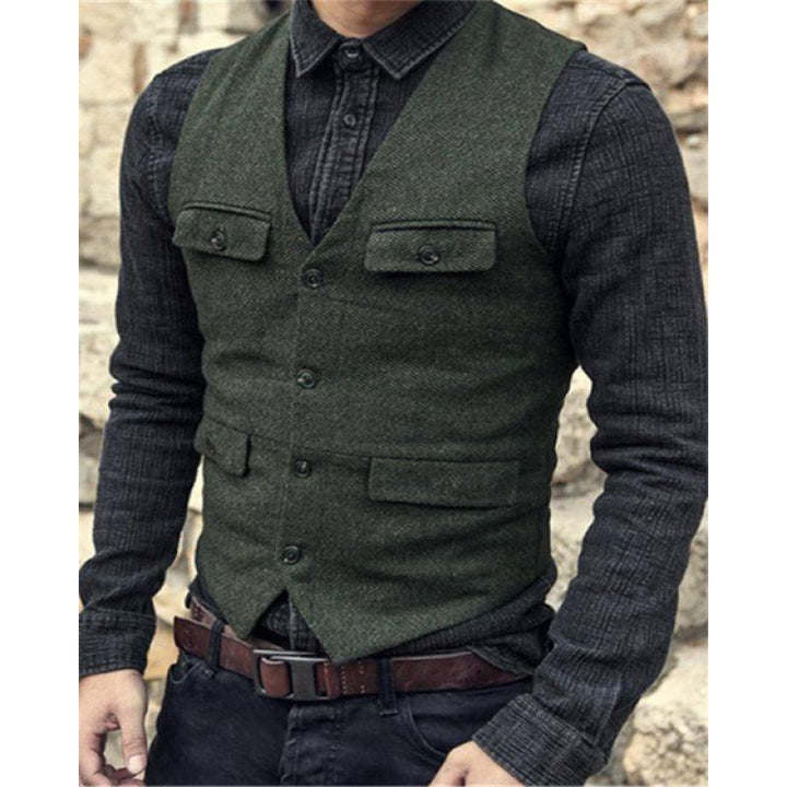 A person is wearing a dark grey long-sleeve shirt made of a cotton blend with a Maramalive™ European And American Men's Vest Casual Solid Color Herringbone Vest and a brown leather belt, exuding British style. The background is blurred.