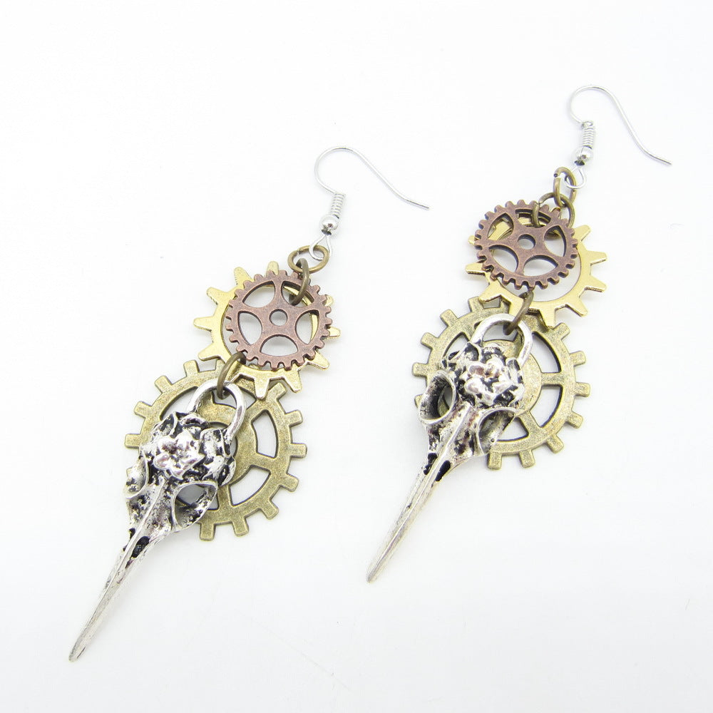 A pair of Maramalive™ Women's Handmade Retro Gear Steampunk Earrings with gears and a skull.