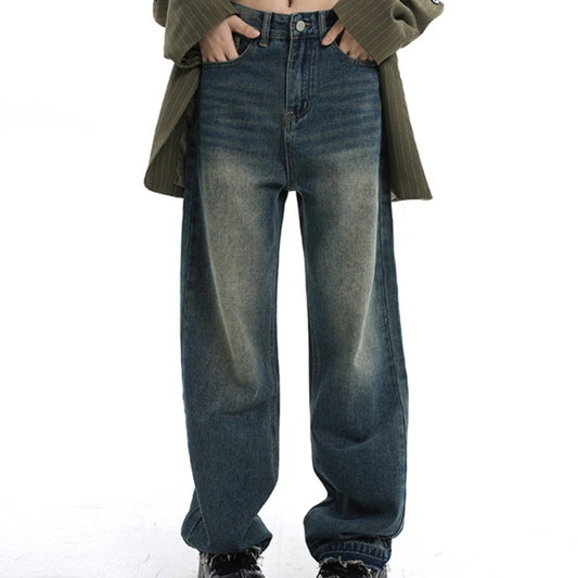 A woman wearing Maramalive™ retro loose fitting wide leg pants - baggy high street mop jeans with waisted straight tube and a green sweater.