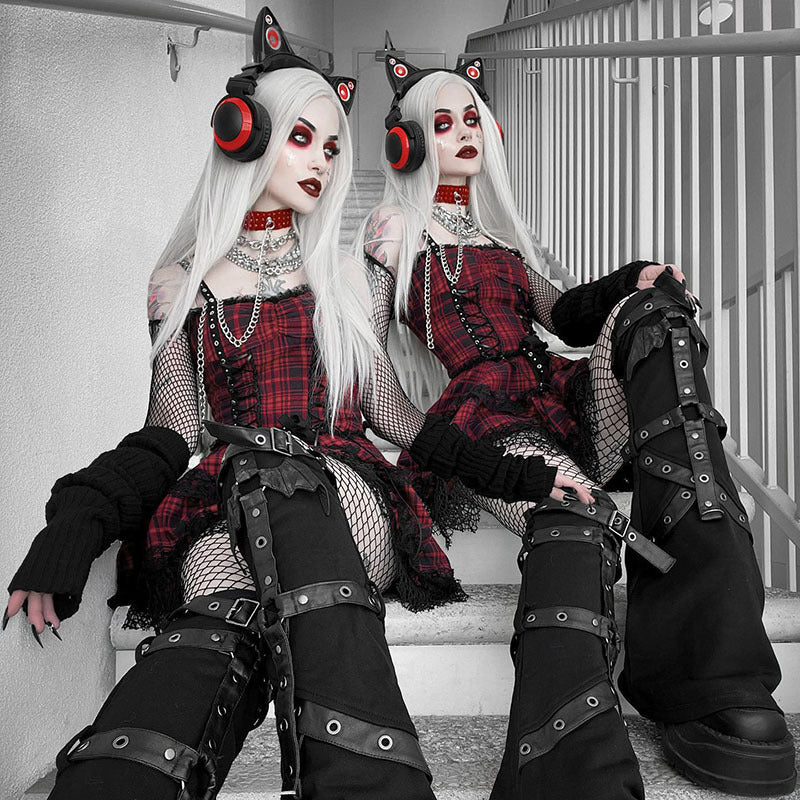 Two women in gothic outfits, one of them wearing the Maramalive™ New Gothic Plaid Suspender Dress - Underworld Tartan Mini-dress, sitting on stairs.