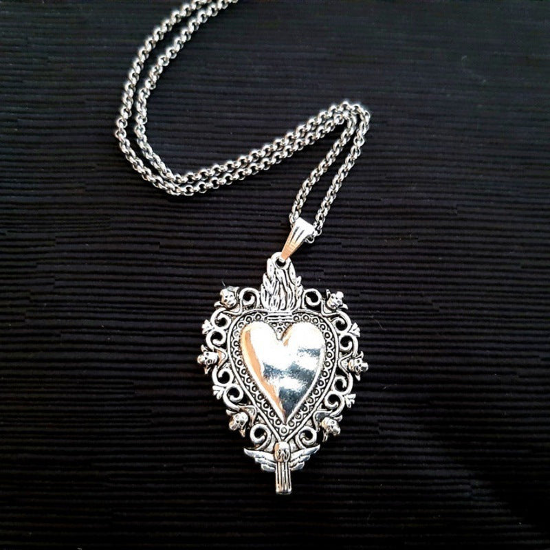 A beautiful Women's Gothic Sacred Heart Pendant Necklace on a black background necklace from Maramalive™.