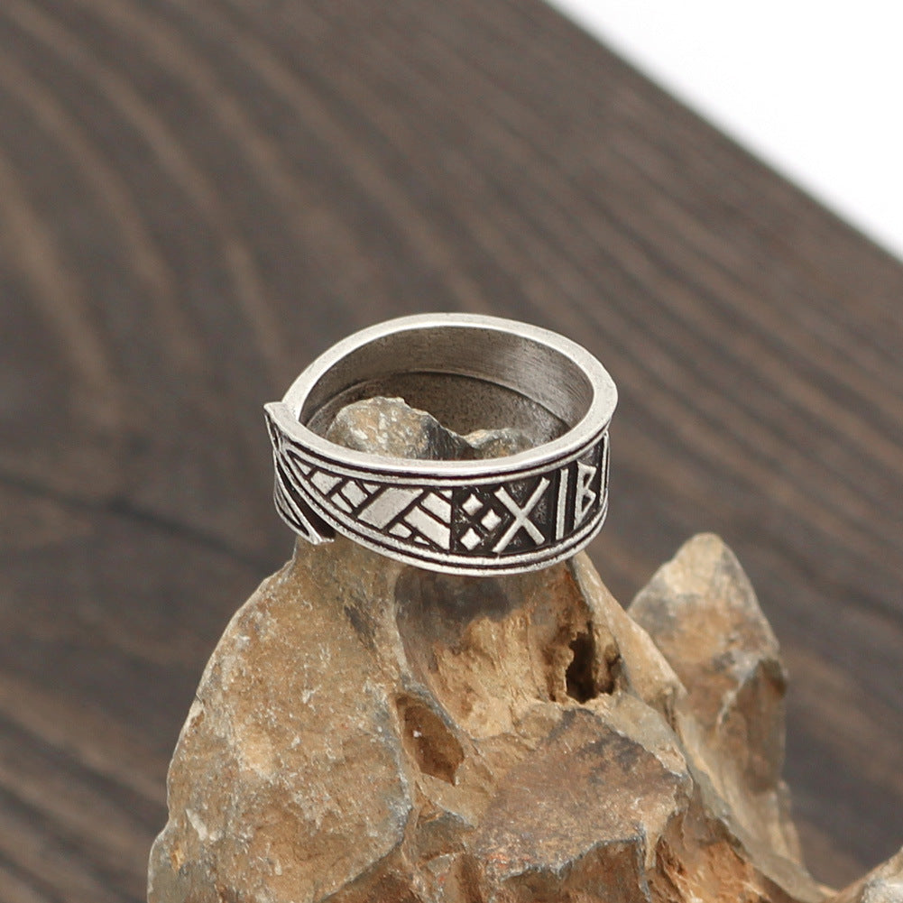 A Nordic Viking Ring Celtic Ring Handmade Adjustable, Nice Ring for Men sitting on top of a rock made by Maramalive™.