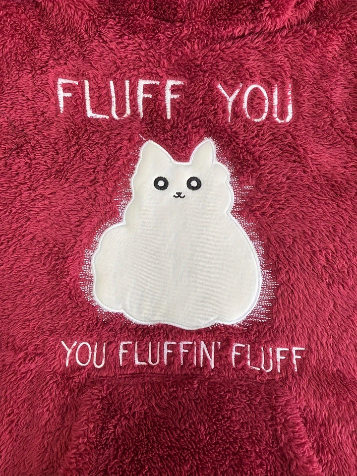 Sure, here is the revised sentence:

"A fluffy, red fabric casual pullover featuring an embroidered white cat with a cartoon pattern, along with the text 'FLUFF YOU' above the cat and 'YOU FLUFFIN' FLUFF' below has been replaced by Maramalive™ Plus Size Casual Sweatshirt, Women's Plus Slogan & Cat Print Fleece Button Decor Long Sleeve Cat Ear Button Decor Sweatshirt With Pockets."

