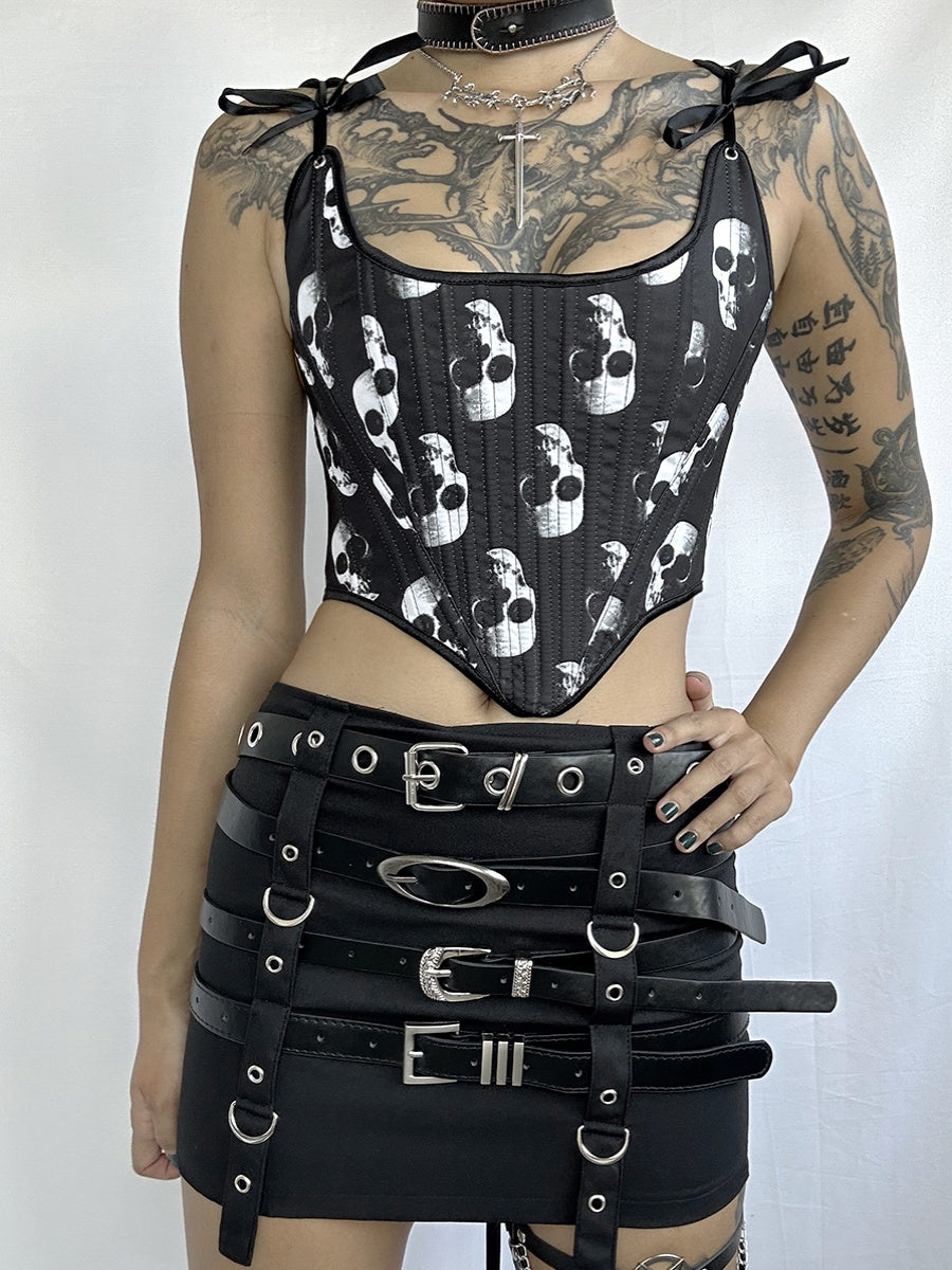 Person wearing the Exclusive Dark Gothic Punk Corset tie Designs Unveiled by Maramalive™, a black multi-belt skirt, and choker with chains. Tattoos cover their arms, chest, and neck.