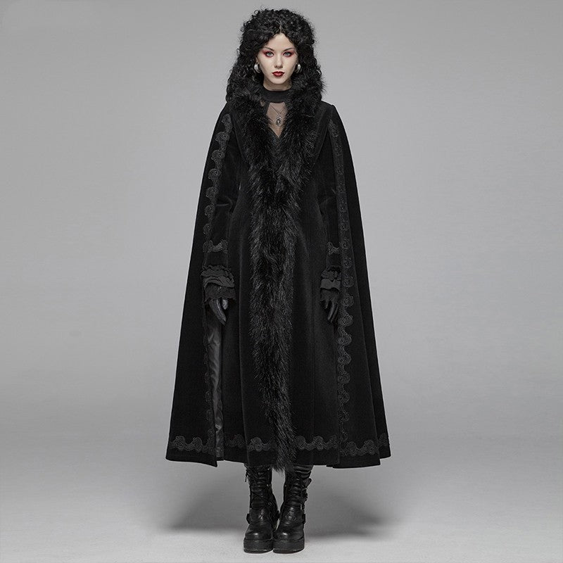 A woman in a Maramalive™ Punk State Women's Half Cape Dark Tie Gothic Retro Gorgeous Long Coat with fur hood.