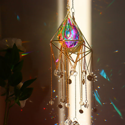 The Crystal Suncatcher Jewelry from Maramalive™ is hanging from a chandelier.