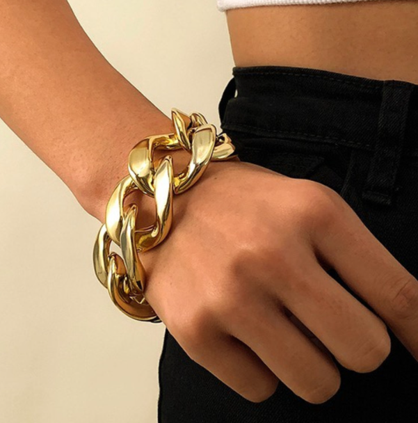 A woman wearing a Boho Punk Chunky Chain Bracelet - Unisex from Maramalive™.