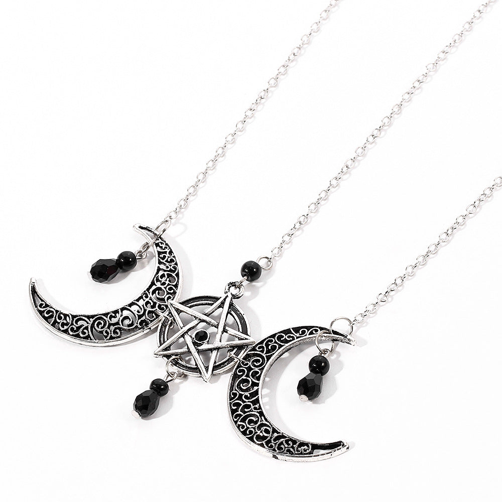 A CJ Gothic Pentagram Necklace Moon Crystal with two crescents on it.