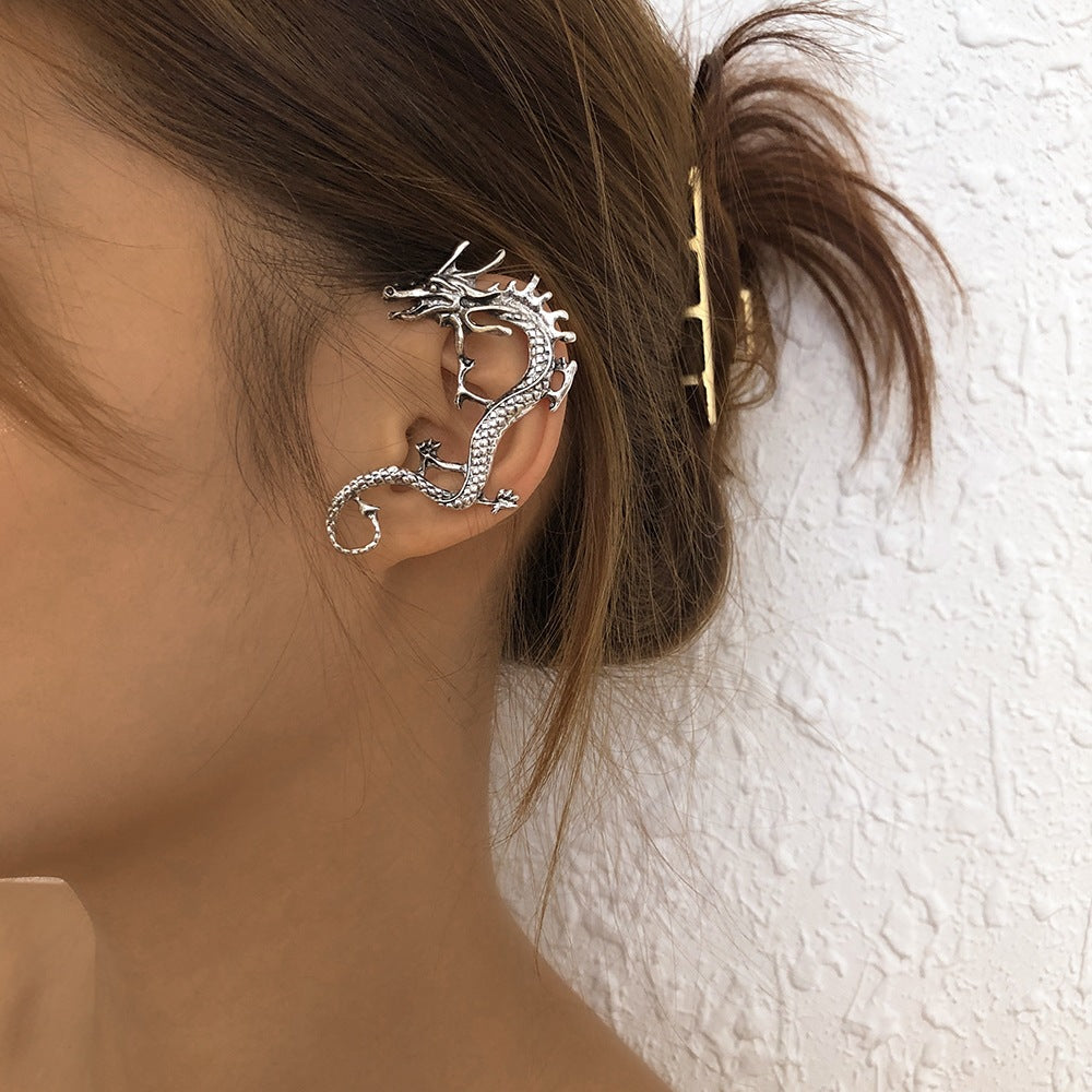 A woman wearing a Maramalive™ Punk Dragon Ear Clip.
