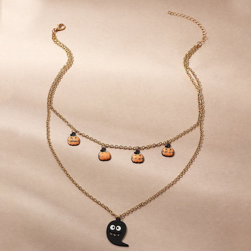 A Halloween Funny Lip Pumpkin Necklace from Maramalive™ with black and red hearts on it.