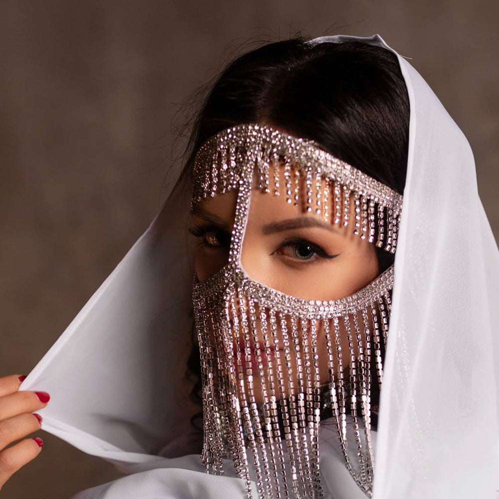 A woman in a green bikini wearing a Maramalive™ Women's Ethnic Style Diamonds Hair Chain Mask For Special Occasions.