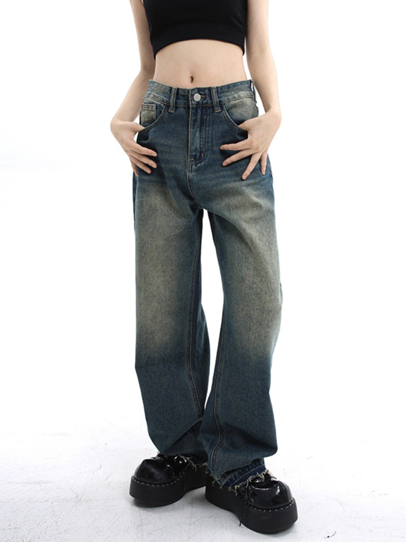 A woman wearing Maramalive™ retro loose fitting wide leg pants - baggy high street mop jeans with waisted straight tube and a green sweater.