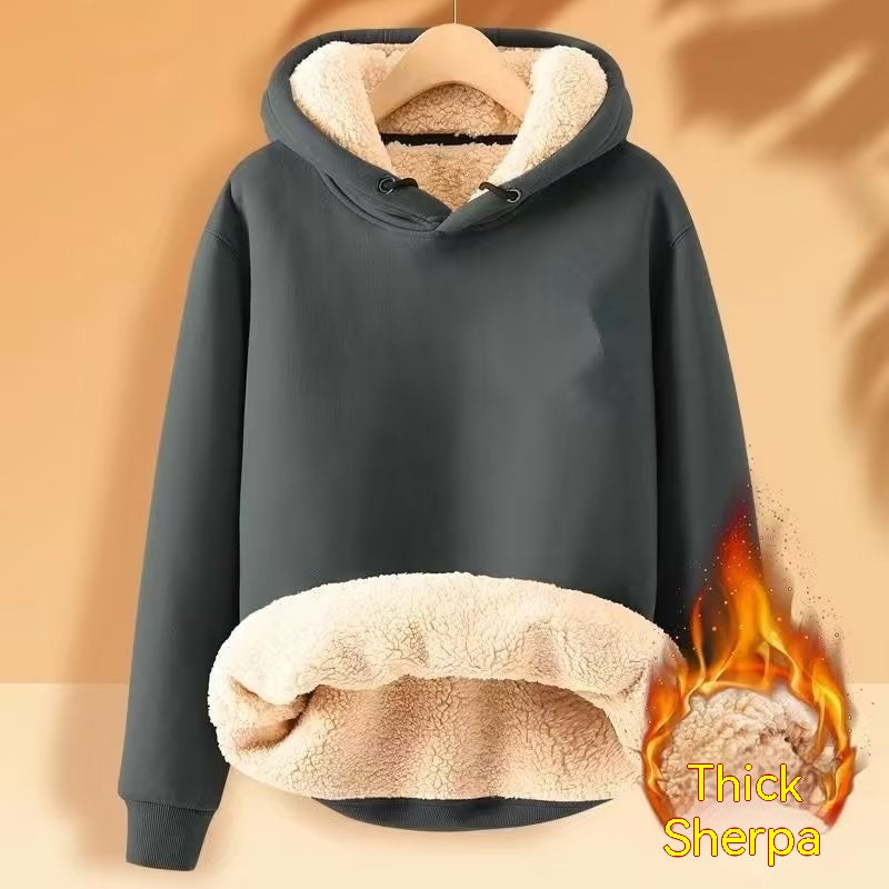 A Maramalive™ Men's Fleece Hoodie Winter Lined Padded Warm Keeping Loose Hooded Sweater in dark gray with thick, cream-colored sherpa wool lining. The hoodie is hanging on a wooden hanger, and there is a graphic flame with the text "Thick Sherpa" in the lower right corner.