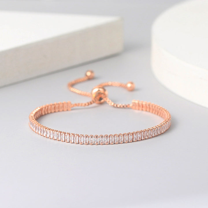 Two Fashion Rectangular Zircon Single Row Full Diamond Adjustable Crystal Bracelets for Women in silver and rose gold by Maramalive™ on a white table.