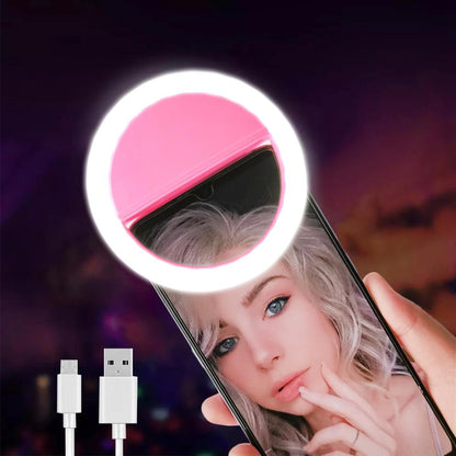 A person holding up a Maramalive™ LED Selfie Ring Light with a pink light on it.