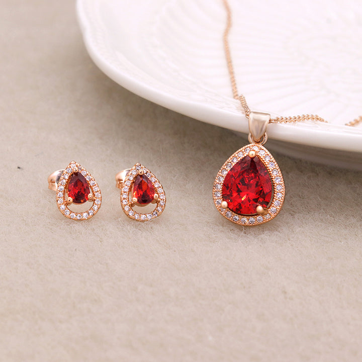 A Zircon Bridal Jewelry Set, brand Maramalive™, featuring a rose gold plated pendant and earring set with red topaz.
