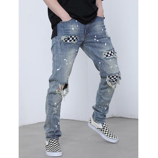 A man wearing Maramalive™ ripped jeans and sneakers.