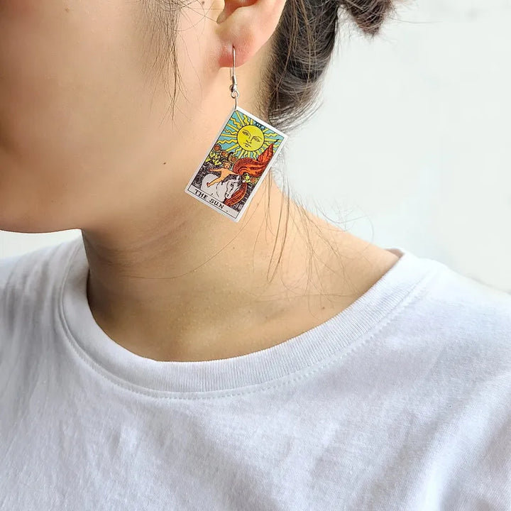 A pair of Acrylic Earrings with the tarot card on them by Maramalive™.