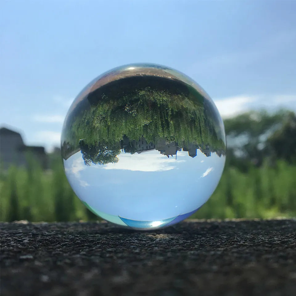 A Happy Glass Sphere with a tree in the background by Maramalive™.