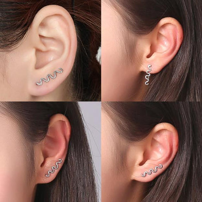 A woman's ear piercings are shown in different pictures featuring the Maramalive™ Serpentine Earrings, which make a striking statement.