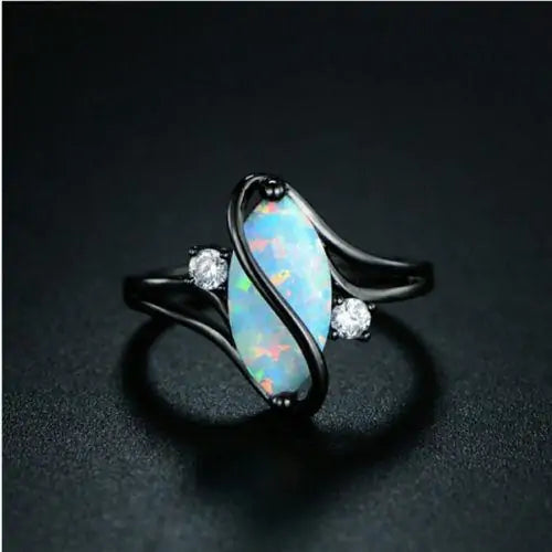 An Luxurious Opal Ring on a black background by Maramalive™.