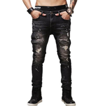 A pair of Maramalive™ MCCKLE Hi-Street Mens Ripped Biker Jeans Black Slim Fit Motorcycle Jeans Men Vintage Distressed Denim Jeans Trousers Pants with a supreme logo on them.