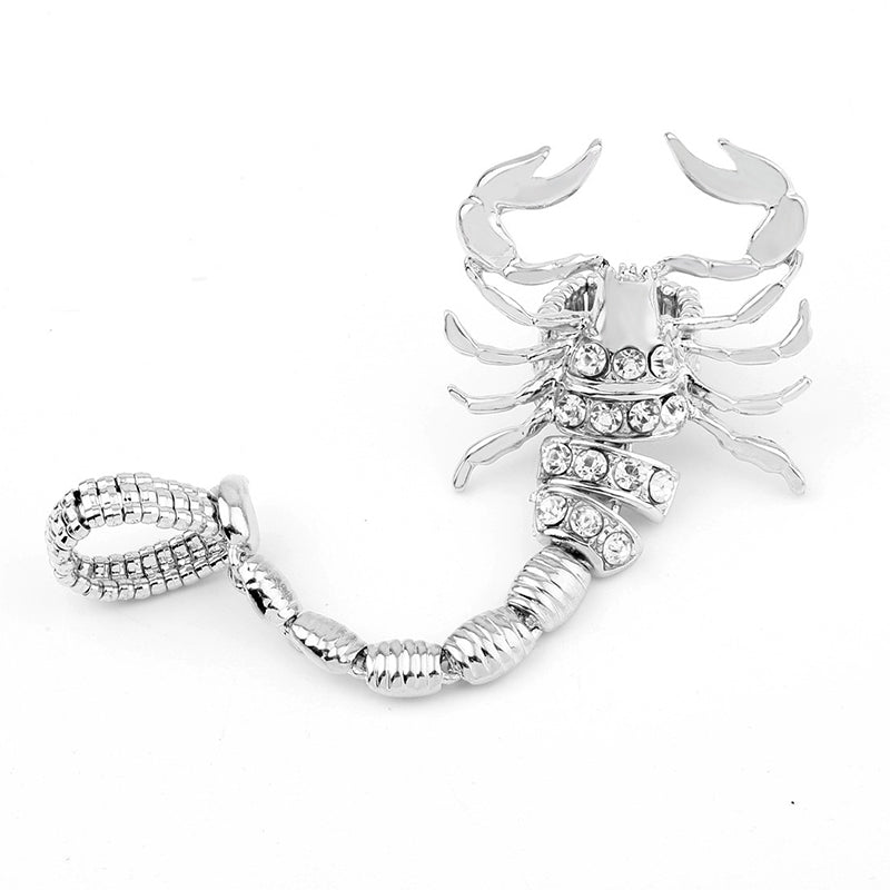 A woman wearing the Maramalive™ Elastic Double Finger Ring with Silver Crystal Scorpion Tail.