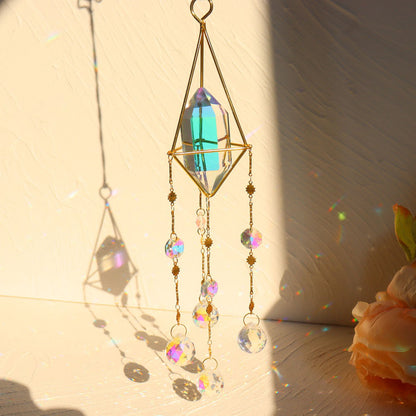 The Crystal Suncatcher Jewelry from Maramalive™ is hanging from a chandelier.